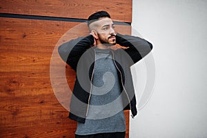 Portrait of stylish arab beard man wear grey turtleneck and black jaket. Arabian model guy