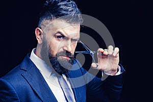Portrait of stylish bearded man. Bearded male. Barber scissors, barber shop. Vintage barbershop, shaving. Portrait of