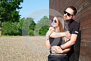 Portrait of stylish confident young couple models in sunglasses