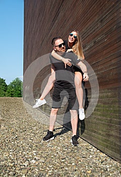 Portrait of stylish confident young couple models in sunglasses