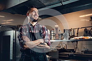 Portrait of stylish cook on a kitchen.