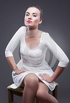 Portrait of Stylish Glamorous Caucasian Woman in White Dress