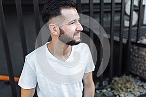 Portrait of a stylish hipster Guy, in a white blank t-shirt, on