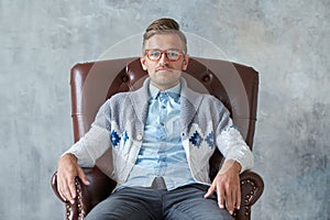 Portrait of a stylish intelligent man with glasses