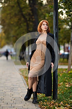 Portrait of Stylish Redhead Woman in Urban Autumn Fashion
