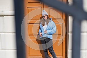 Portrait of a stylish woman in blue jacket