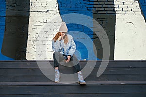 Portrait of a stylish woman in blue jacket