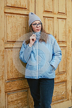 Portrait of a stylish woman in blue jacket