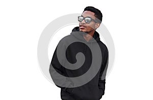 Portrait of stylish young african man looking away wearing black hoodie, sunglasses isolated on white background