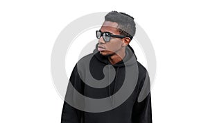 Portrait stylish young african man posing looking away wearing a black hoodie, sunglasses isolated on white background