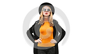 Portrait of stylish young blonde woman model wearing black coat, round hat  on white background