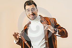 portrait of stylish young man looking away while posing