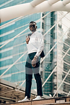 Portrait of successful african businessman outdoor in modern city