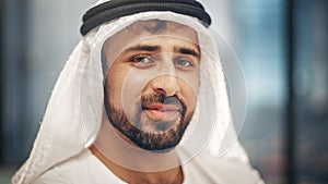 Portrait of Successful Arab Businessman in Traditional Outfit Gently Smiling, Wearing White Kandur