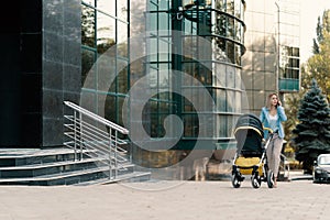 Portrait of a successful business woman in blue suit with baby