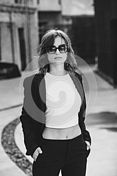 Portrait of a successful business woman in front of modern business building.