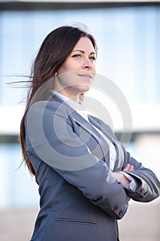 Portrait of a successful business woman smiling. Beautiful young female executive in an urban setting