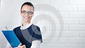 Portrait of successful business woman smiling and looking at camera
