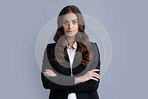 Portrait of successful business woman in suit on gray isolated background. Serious office female worker, manager