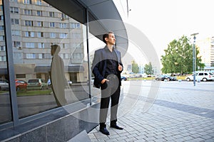 Portrait of successful businessman in formals standing