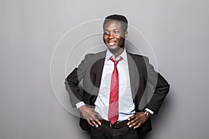 Portrait of a successful confident african businessman professional in a smart formal suit isolated