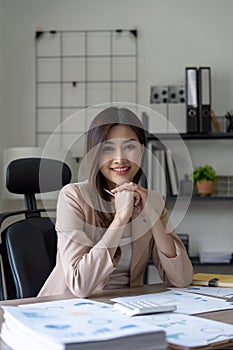 Portrait of successful confident pretty, Young asian business woman or freelancer wearing formal stylish clothes, arms