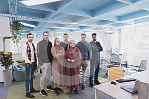 Portrait of a successful creative business team looking at camera and smiling. Diverse business people standing together