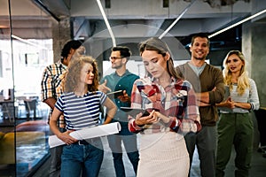 Portrait of successful creative business team looking at camera, smiling. Startup success concept.