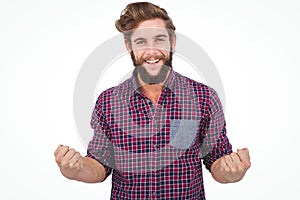 Portrait of successful hipster with clenched fist