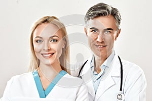 Portrait of successful medical team. Male and female doctors looking at camera and smiling. Working together in a