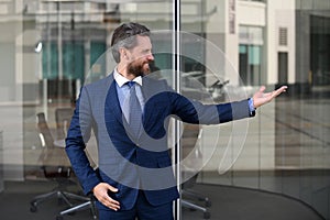 Portrait of successful office worker wearing classic outfit suit. Happy and excited winner gesture with raised arms