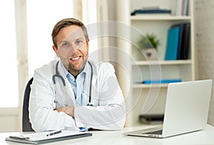 Portrait of successful specialist doctor working in hospital office looking happy and confident