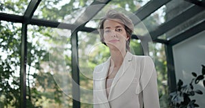 portrait of successful young business woman looking serious confident at camera in office workspace