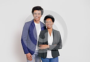 Portrait of successful young businessman and businesswoman smiling at camera on white background