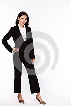 Portrait successful young businesswoman. Confident business professional female smiling in smart suit and wear high heels shoes.