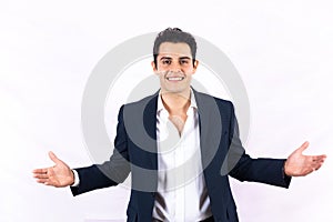 Portrait of successful young latin businessman with open arms on white background in Mexico Latin America