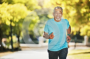 Portrait, summer and an old man running in the park for fitness, cardio training or a marathon. Exercise, smile and a