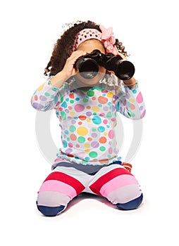Portrait of super cute black girl with binoculars