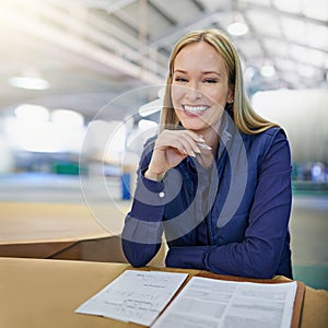 Portrait, supervisor and smile as businesswoman in logistics at factory with machines for supply chain. Woman, warehouse