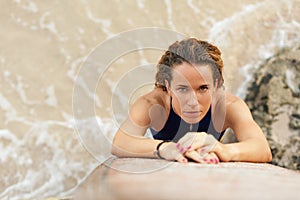 Portrait surfer girl in bikini with surfboard on the beach