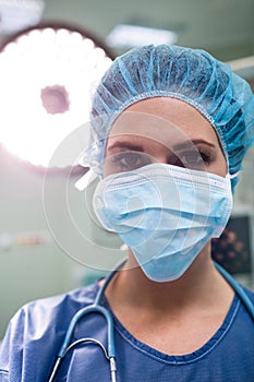 Portrait of surgeon wearing surgical mask in operation room