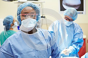 Portrait Of Surgeon Working In Operating Theatre