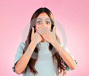 Portrait, surprise and woman cover mouth, gossip and scared girl against pink studio background. Face, female and lady