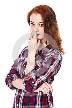 Portrait of surprised beautiful young red-haired girl looking at