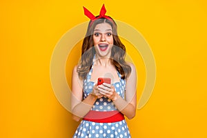 Portrait surprised energetic blogger girl use cell phone read social network news impressed scream wow omg wear blue