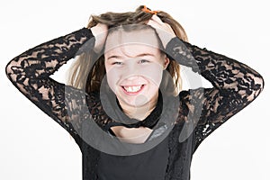 Portrait of surprised excited girl with open mouth touching head