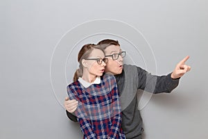 Portrait of surprised man and woman looking at something unbelievable