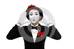 Portrait of the surprised mime with their hands up