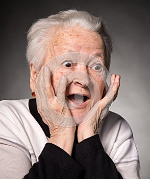 Portrait of surprised old woman