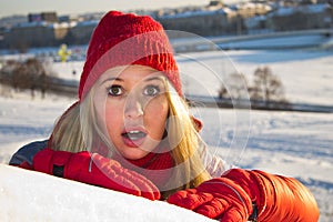 Portrait of surprised woman in winter